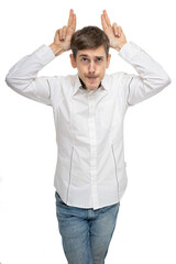 Young handsome tall slim white man with brown hair making ears from his hands in white shirt isolated on white background