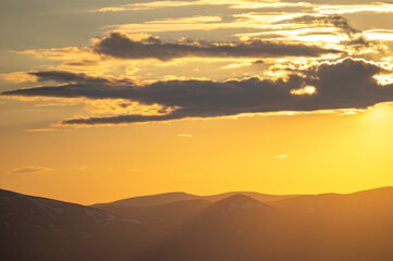 Fototapeta na wymiar Beautiful orange sky during dusk in the carpathian mountains