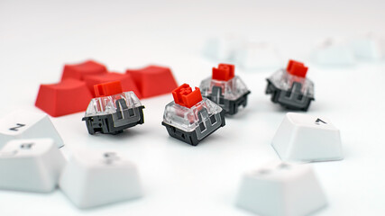 Mechanical keyboard switches. Red switches of the gaming mechanical keyboard, selective focus - obrazy, fototapety, plakaty