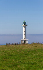 Lastres lighthouse on the coast facing the sea