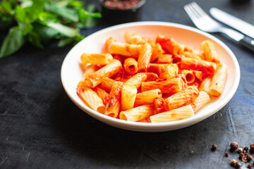 pasta tomato sauce vegetables ziti or penne macaroni dish italian cuisine classic on the table healthy food meal snack copy space food background rustic top view veggie vegan or vegetarian food