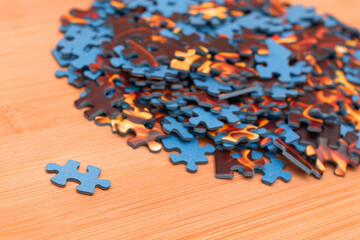 Colorful Peaces of a Mixed Jigsaw Puzzle Lie on the Wooden Table - Strategy and Solving Problem...