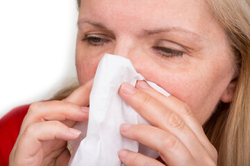 Mature woman is wiping out the nose