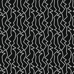Vertical white zigzags on a black background. Seamless pattern for any use.