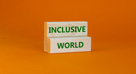 Inclusive world symbol. Wooden blocks with words Inclusive world on beautiful orange background. Business, inclusive world concept. Copy space.