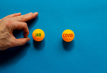 Covid-19 delta variant strain symbol. Male hand is about to flick the ball. Orange table tennis...