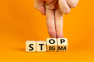 Stop stigma symbol. Doctor turns cubes with words stop stigma. Beautiful orange background. Medical and stop stigma concept. Copy space.
