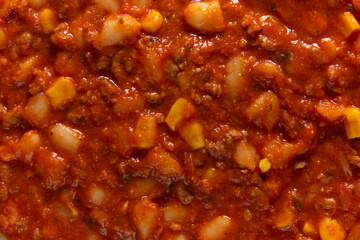 Traditional Hot chili sauce. Chopped meat, white beans, korn pepper, paprika in a tomato sauce. on...