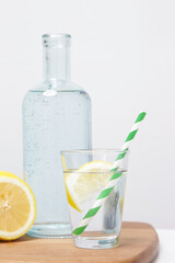 Lemon water with bamboo straw. Healthy detox drink. Reusable bamboo straws as an alternative for single-use plastic straws, healthy and sustainable lifestyle concept