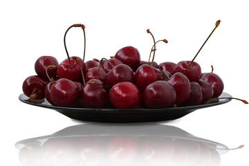 ripe sweet cherries in a plate isolated on white background