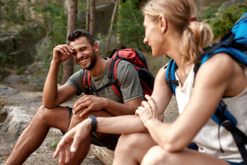 Happy young caucasian couple talking during halt