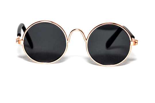 Close-up Of Round Sunglasses On A White Background. Gold Setting.