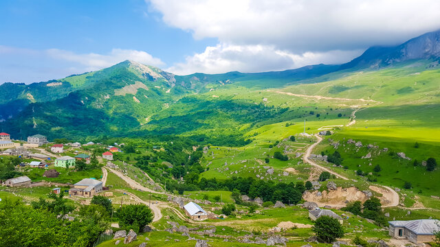 Colorful summer in the mountains of Azerbaijan. Village and road in the Quba district
