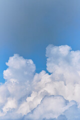Naklejka na ściany i meble Lift your head up and you will see beauty of sky. Thick white clouds in bright blue sky. Minimalistic background for ad text or desktop screensaver.