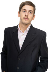 Young handsome tall slim white man with brown hair looks haughty in black blazer isolated on white background