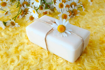 Natural, herbal, chamomile soap. Chamomile flowers. White. Sauna, spa concept. Background