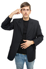 Young handsome tall slim white man with brown hair pointing at his head in black blazer in blue jeans isolated on white background