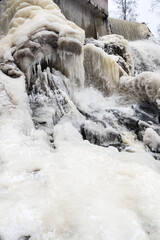 Fototapeta na wymiar Partly frozen Keila-Joa waterfall in winter
