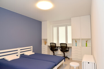White furniture in the interior of a modern bedroom