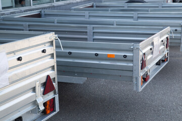 A store that sells trailers.Car open trailer. Transport for cargo transportation.