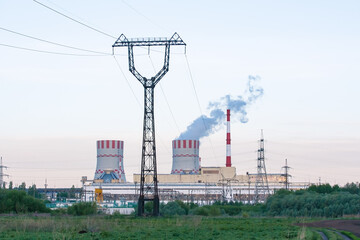 Industrial zone with power station atomic energy production. Nuclear power plant emissions of steam in the air atmosphere