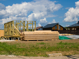 The process of building a private wooden-frame house. Under constructio