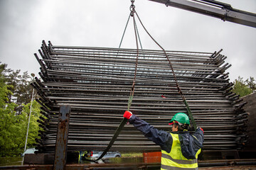 Extensive metal scaffolding providing platforms for workers, used in construction areas.