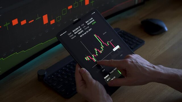 Checking bitcoin price patterns on a tablet
