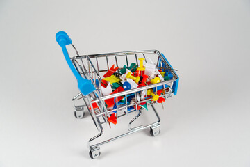 Pushpins in the shopping cart. Purchased from an office supply store.