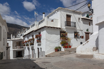 The picturesque small streets in ancient white village Las Alpujarras, Granada Province, Spain