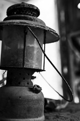 Antique Lantern rusting on a Old Table in a Nineteenth Century Cabin.