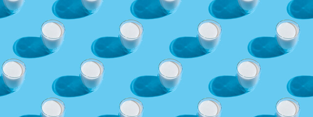 World Milk Day. Pattern on a blue background. A glass of milk. Template. Seamless pattern. Banner