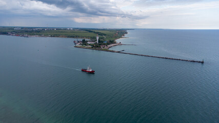 Fire boat on duty in the port water area. Aerial view.