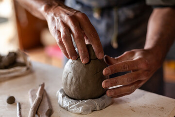 close up of hands of a potter
