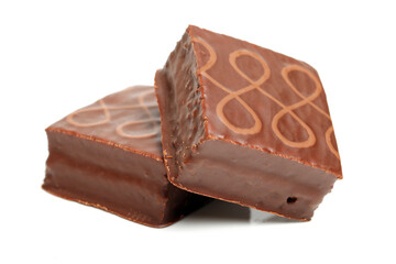 Chocolate peanut candy on white background