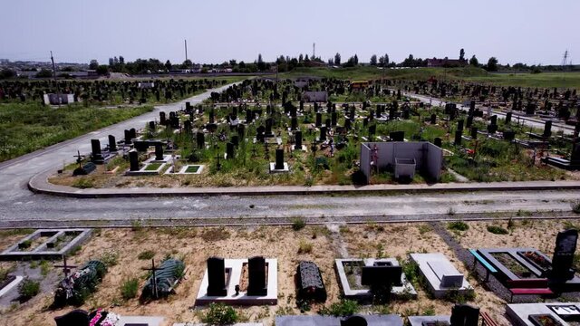 Aerial View of Cemetery. Cemetery with gravestones during day time. 4k stock footage.