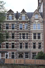 Fototapeta na wymiar Amsterdam Da Costakade Canal Traditional Brick House Facades