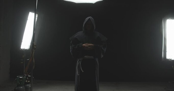 Camera Moves Closer Capturing a Serious Male Monk 