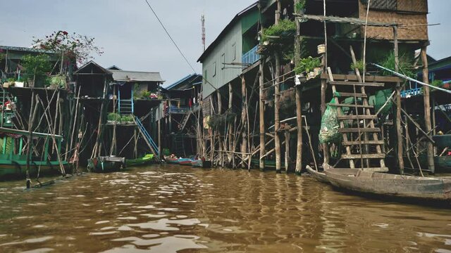 Panning Shot Across a Panorama of Local Houses on Stilts in Cambodia