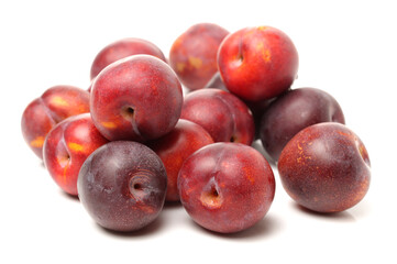 plums isolated on white