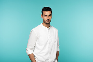 Mad arabian man looking at camera isolated on blue