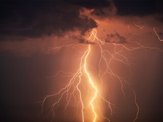 There are many lightning bolts against the black sky. Night photo of a thunderstorm on a long...