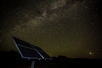 solar panels with night sky and Milky Way