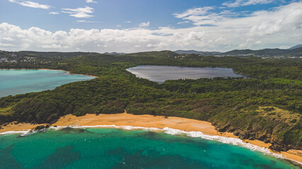 Arial view Play Colora and lagoon surrounded by jungle in tropical Puerto Rico