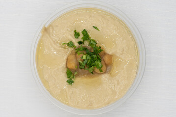Overhead view of baba Ganoush salad presented in a clear bowl for a Mediterranean meal on the go
