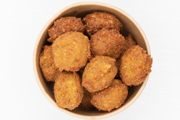 Cup full of bite size falafels to eat like a cup of Mediterranean cuisine popcorn