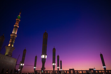 A low angle view of Masjid Nabawi (Nabawi Mosque) facing Baqee; cemetary during sunrise in Madinah, Saudi Arabia.