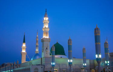 View of green dome of Nabawi Mosque in the morning during sunrise in Al Madinah, Saudi Arabia.