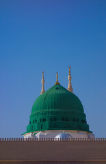 View of green dome of Nabawi Mosque in the morning during afternoon in Al Madinah, Saudi Arabia.