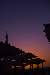 Giant canopies at the outer court of Masjid Nabawi in Madinah, Saudi Arabia during sunrise.